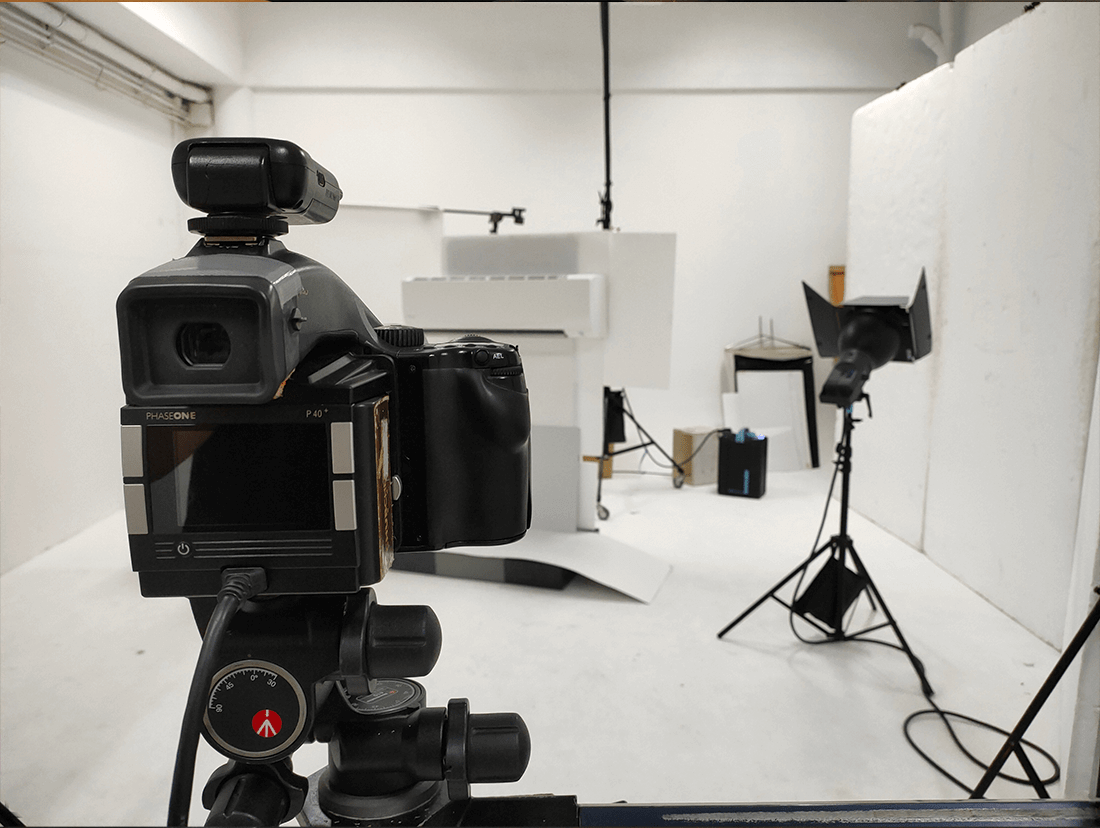 A camera is set up in a photo studio.